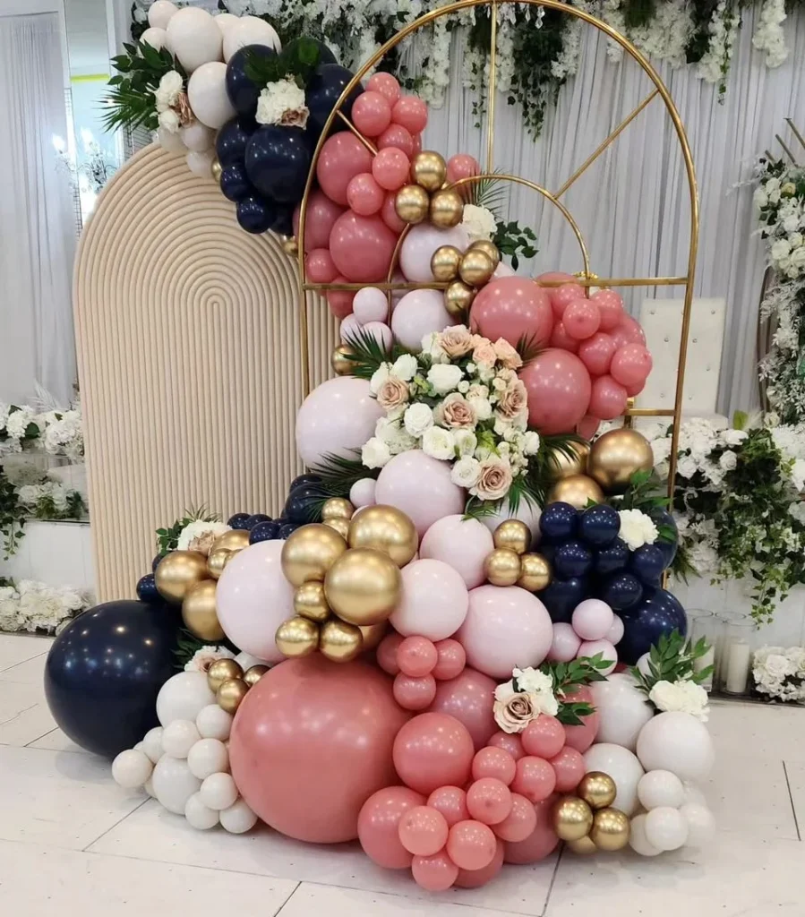 Blush, navy and gold garland with florals by JM Balloons and Beyond